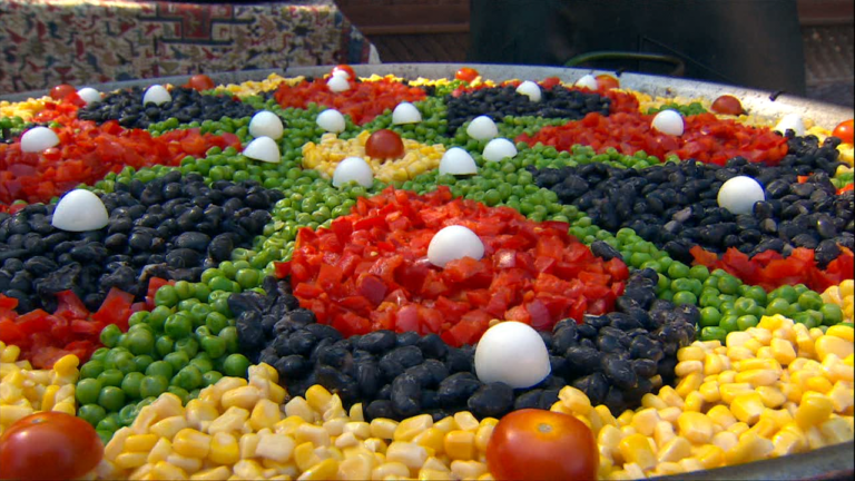 Paul’s Paellas spent nearly four hours making a paella live on KUSI News –